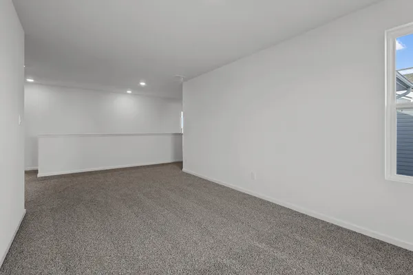 a view of an empty room and closet area