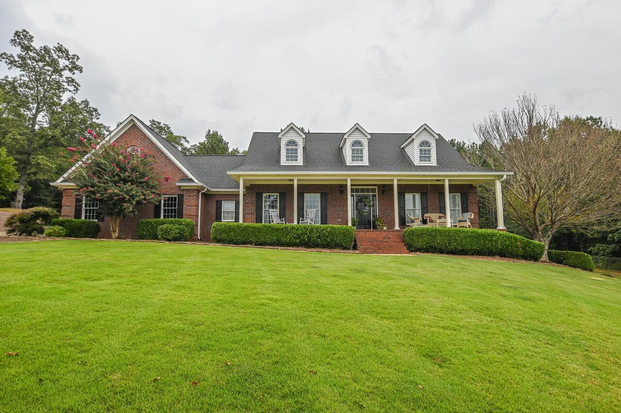 1330 Brush Creek Road Colbert, GA 30628 - Photo 1 of 1 a front view of a house with a garden