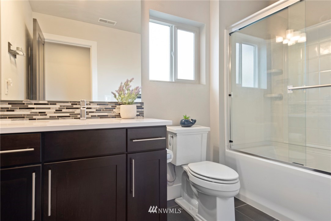 20619 3rd Avenue Southeast Bothell, WA 98012 - Photo 20 of 28 a bathroom with a sink a toilet and shower