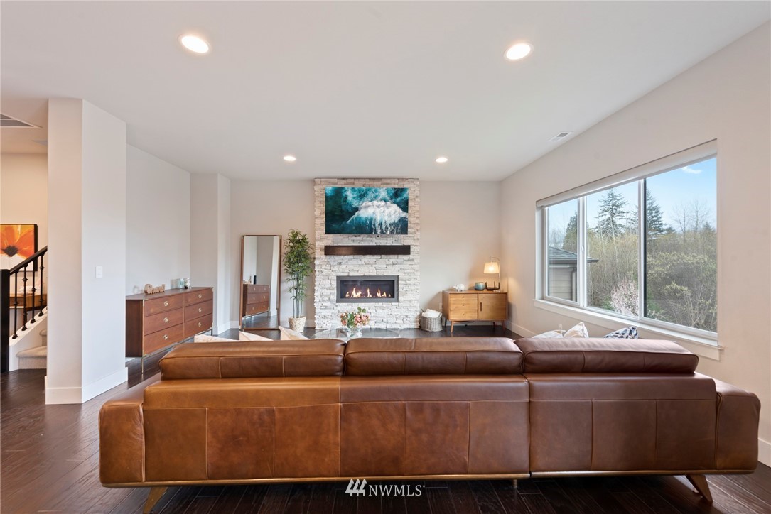 20619 3rd Avenue Southeast Bothell, WA 98012 - Photo 3 of 28 a living room with fireplace furniture and a large window