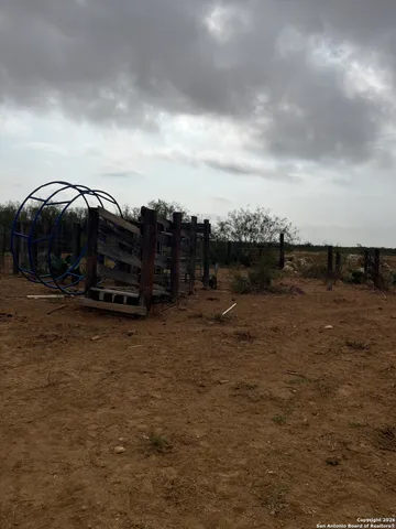 a car parked in the middle of a field