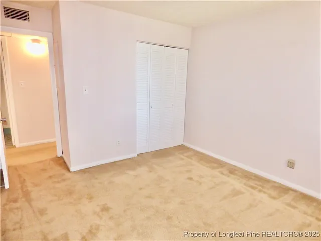 a white toilet sitting next to a sink