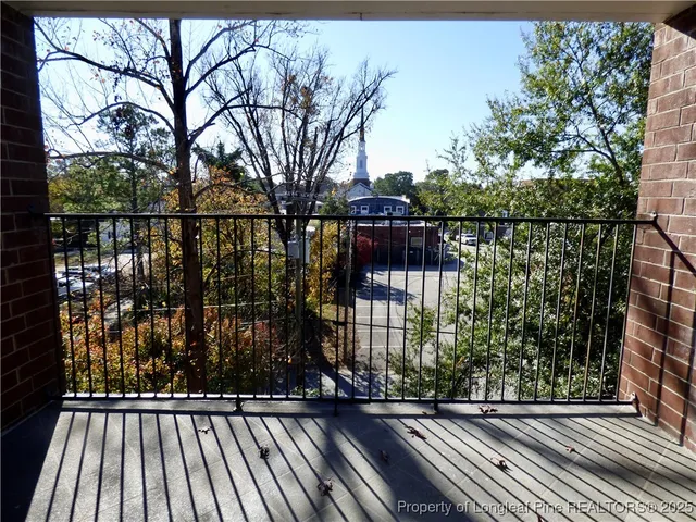 a view of balcony with a small yard