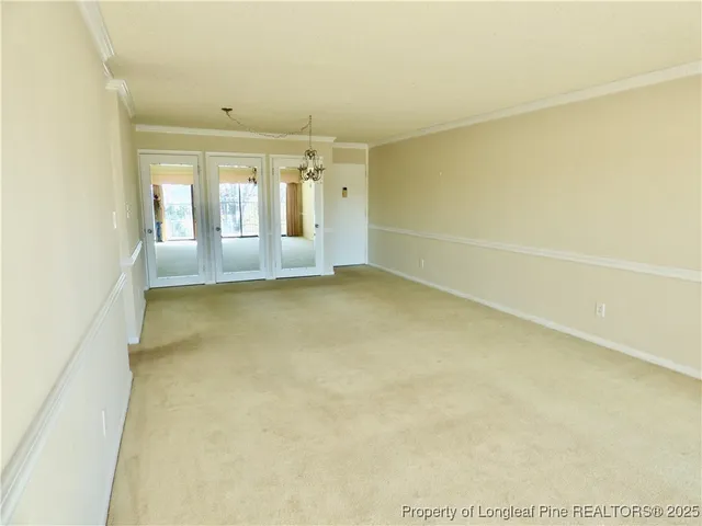 a kitchen with granite countertop white cabinets and a sink