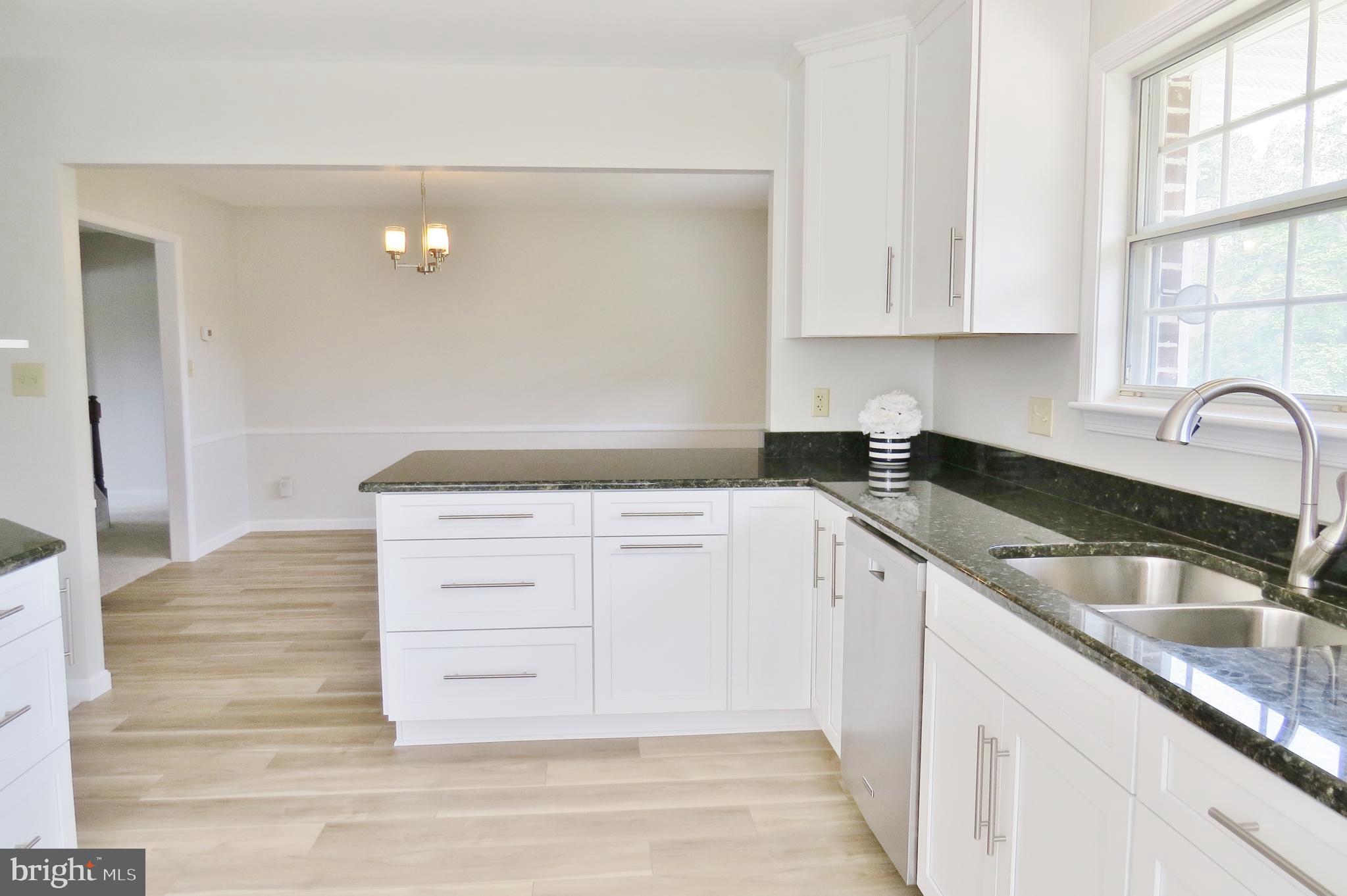 49945 Fenwick's Pride Lane Ridge, MD 20680 - Photo 26 of 64 Open Kitchen with Double Sinks & New Flooring