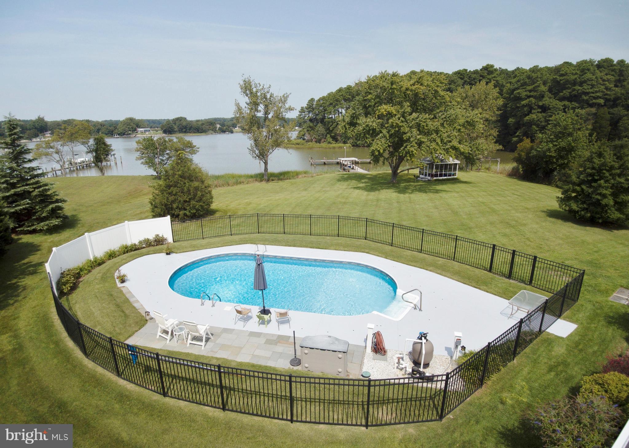 49945 Fenwick's Pride Lane Ridge, MD 20680 - Photo 56 of 64 Fenced in-ground pool overlooking the water