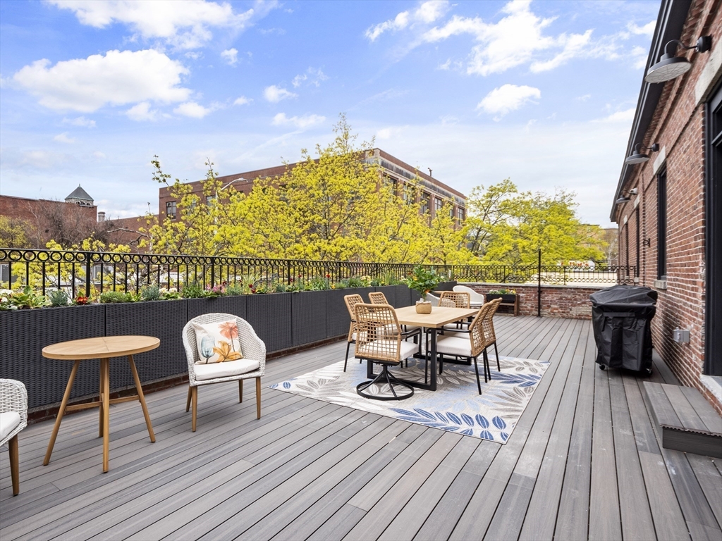 140 Middlesex Street, Unit 3 Lowell, MA 01852 - Photo 26 of 30 a view of a chairs on the roof deck