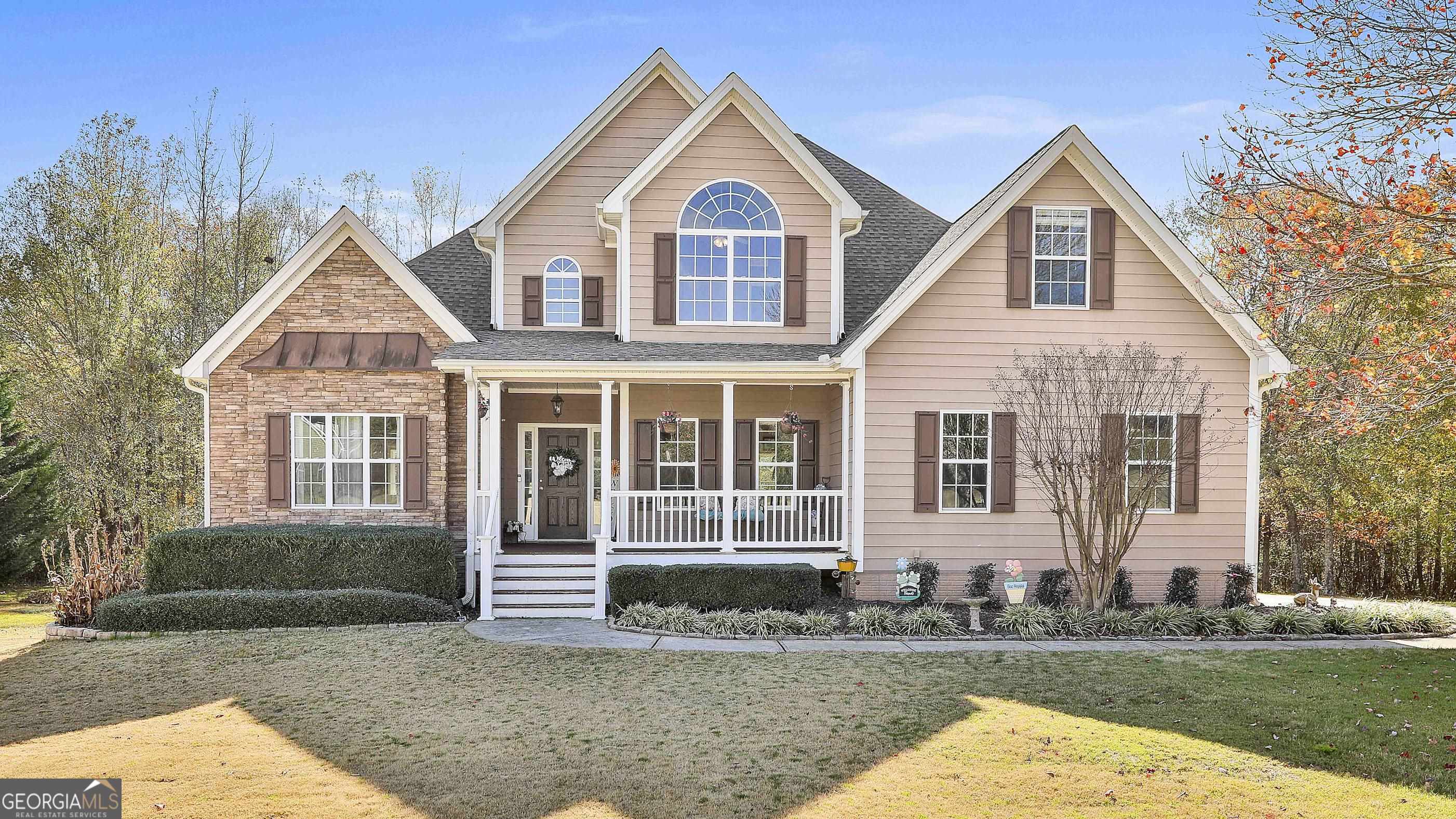 a front view of a house with a yard