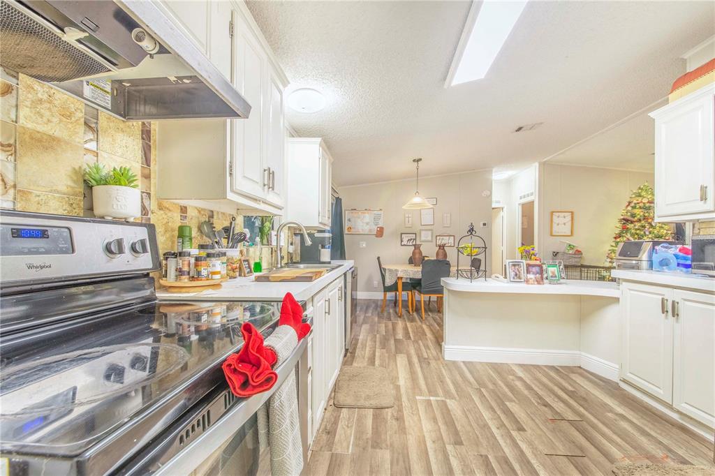 2747 Old Bartow Road Lake Wales, FL 33859 - Photo 12 of 30 a view of a kitchen and dining room