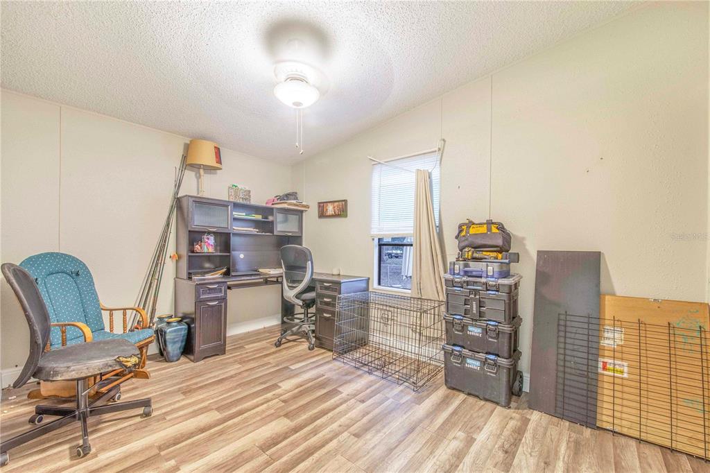 2747 Old Bartow Road Lake Wales, FL 33859 - Photo 18 of 30 a room with furniture and a wooden floor