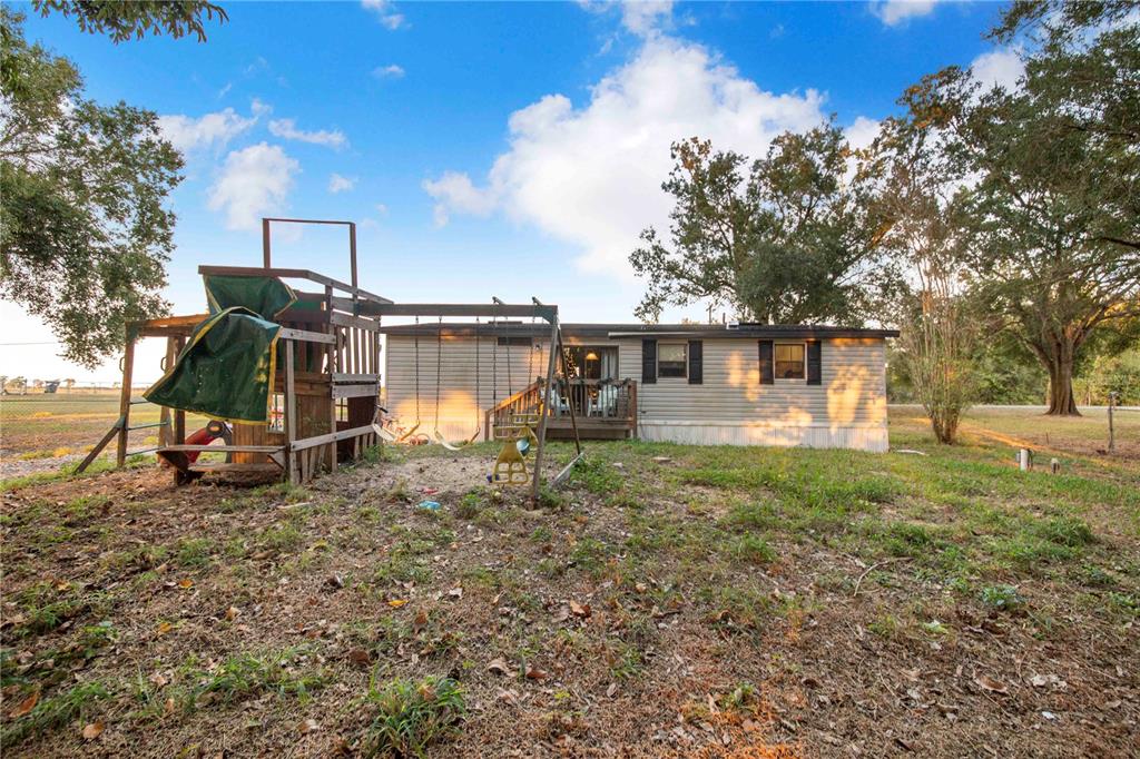 2747 Old Bartow Road Lake Wales, FL 33859 - Photo 23 of 30 a view of a house with a yard