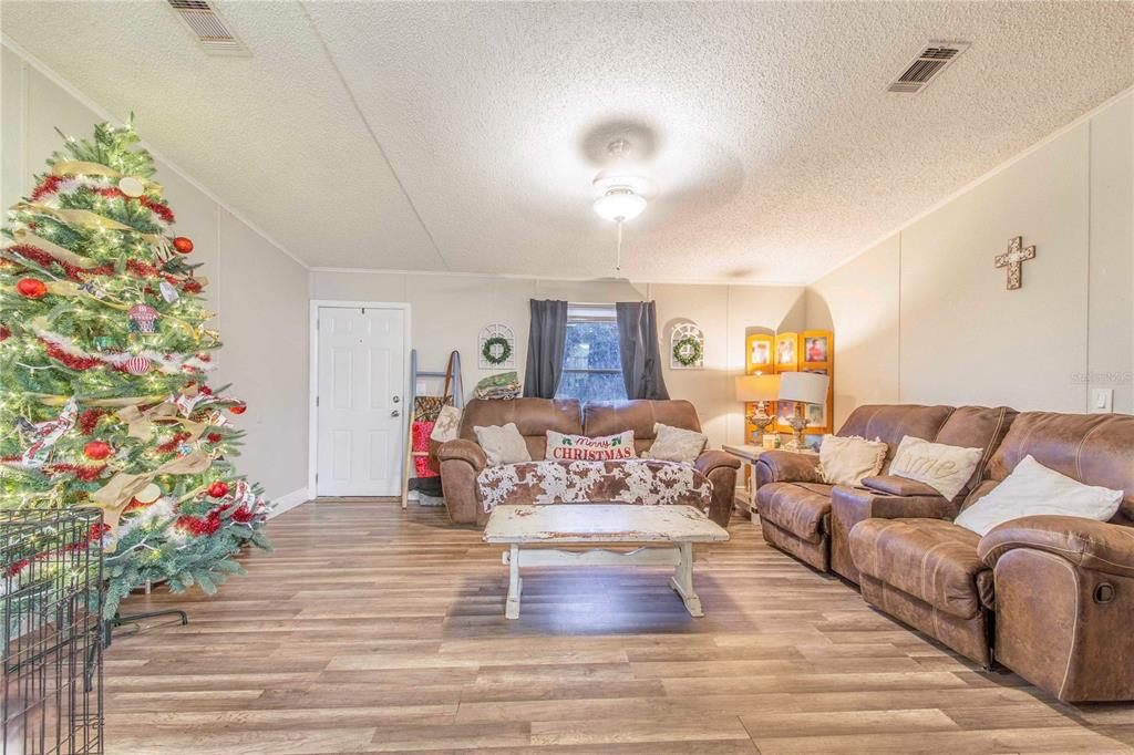 2747 Old Bartow Road Lake Wales, FL 33859 - Photo 5 of 30 a living room with furniture and flowers
