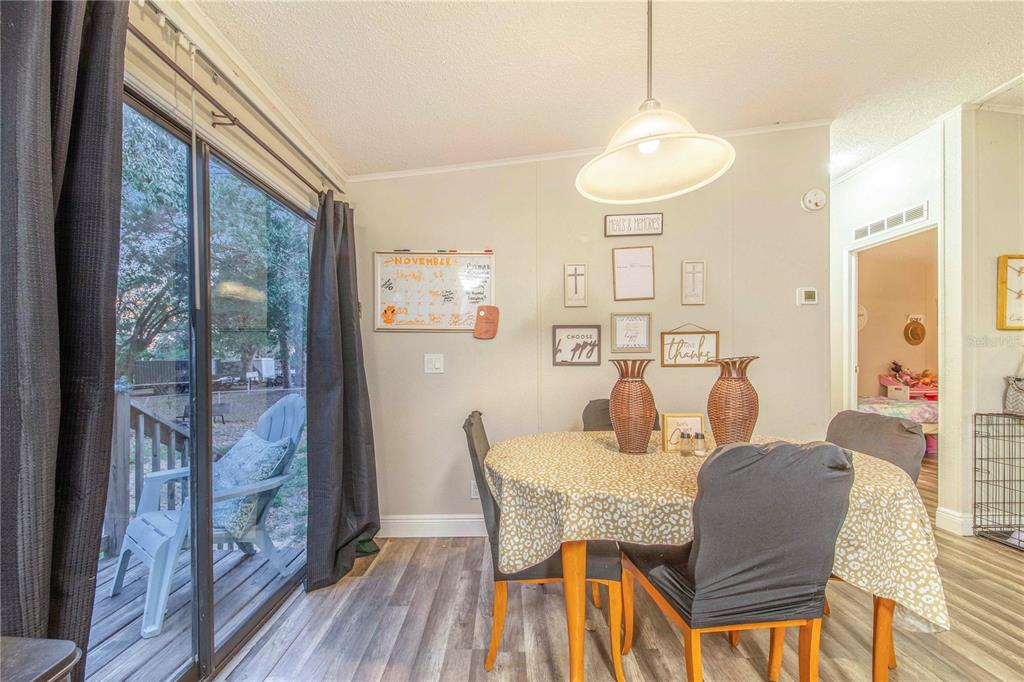 2747 Old Bartow Road Lake Wales, FL 33859 - Photo 9 of 30 a dining room with furniture and wooden floor