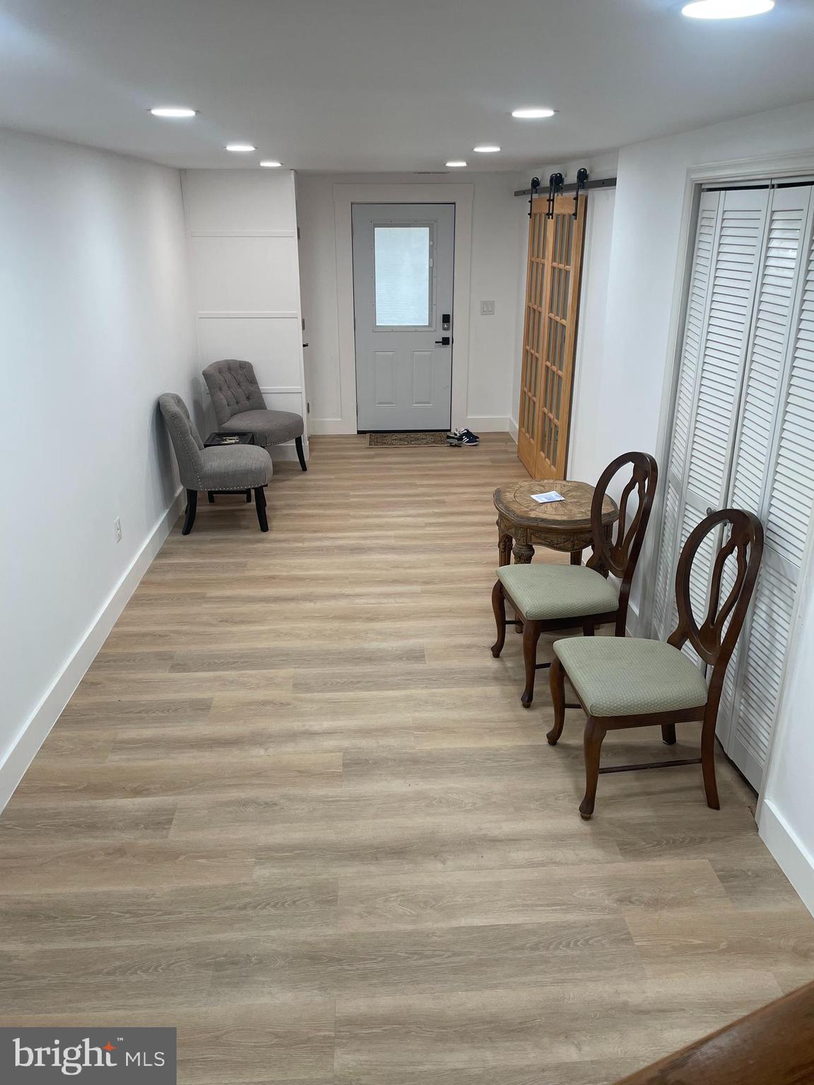 8917 Old Courthouse Road Vienna, VA 22182 - Photo 6 of 17 a living room with furniture and a rug