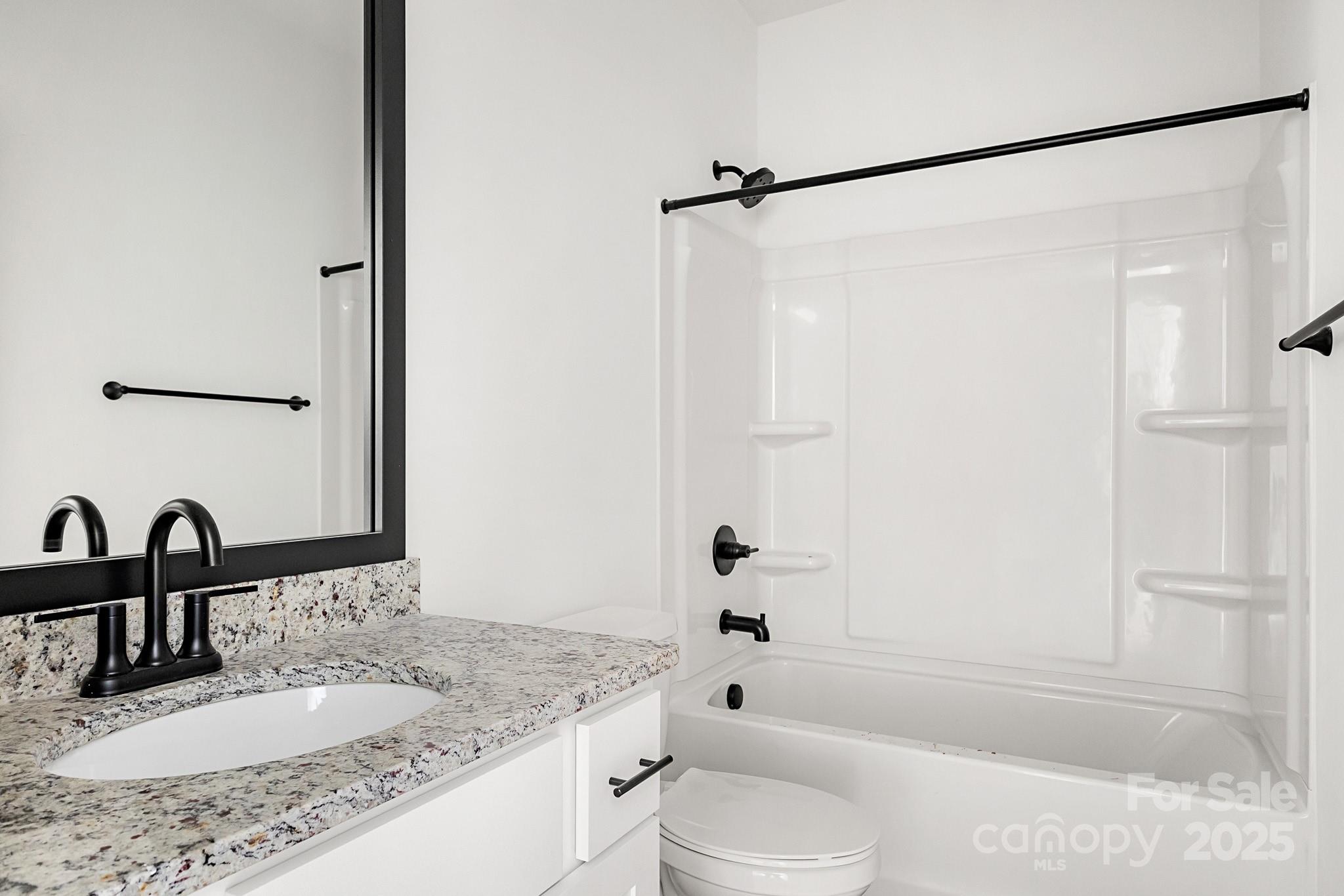3309 Old Pageland Monroe Road Monroe, NC 28112 - Photo 21 of 37 a bathroom with a granite countertop sink toilet and shower