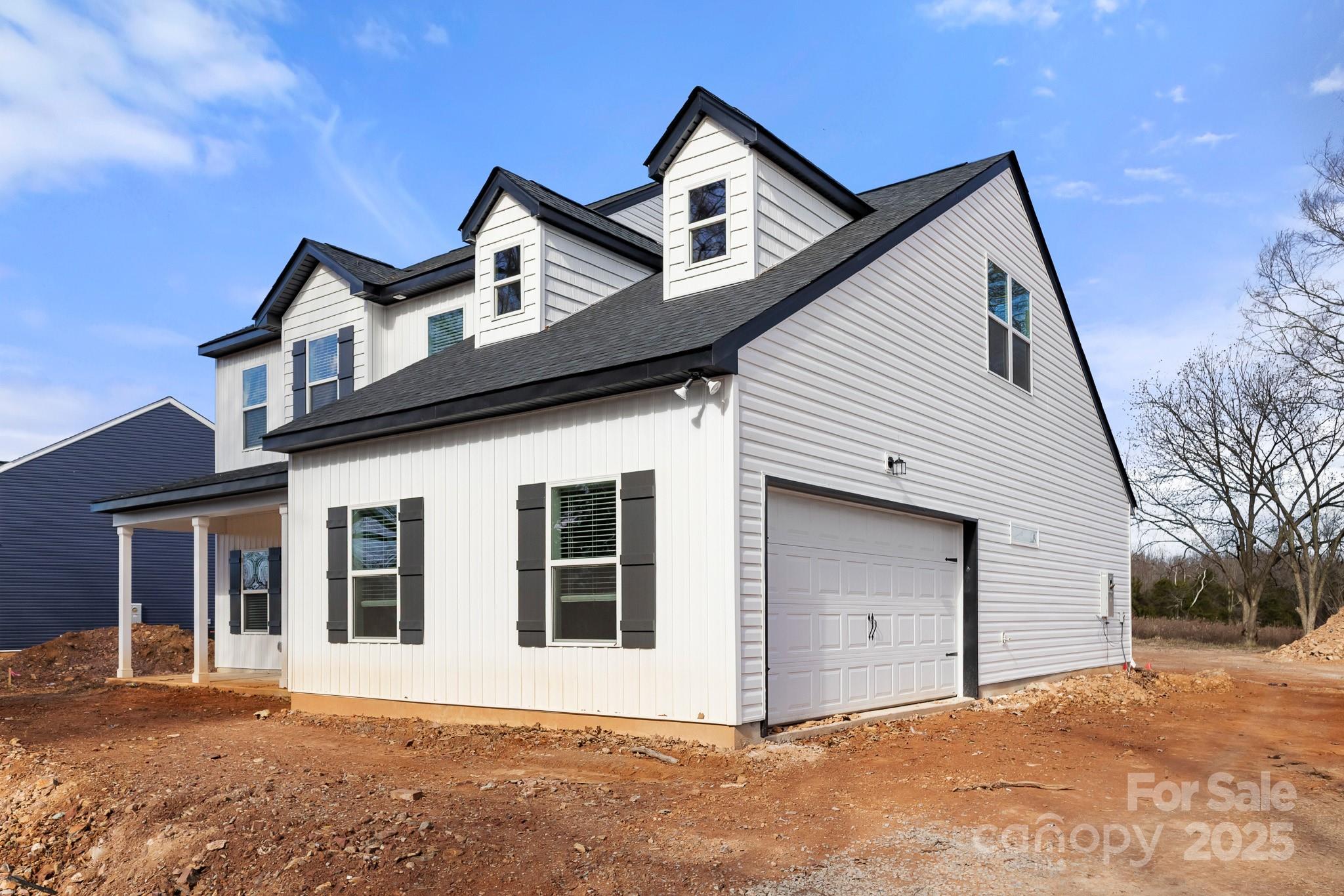 3309 Old Pageland Monroe Road Monroe, NC 28112 - Photo 34 of 37 a front view of a house with a yard and garage