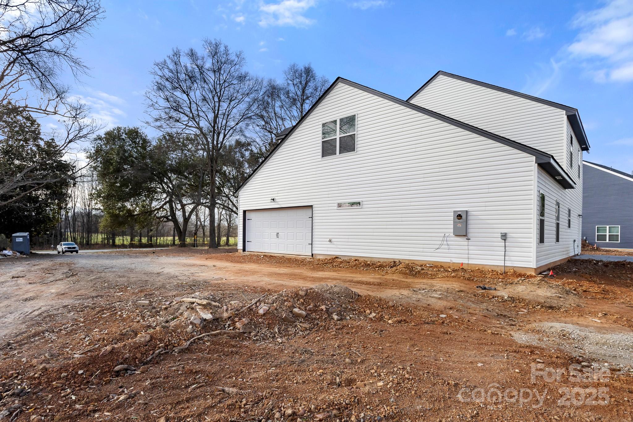 3309 Old Pageland Monroe Road Monroe, NC 28112 - Photo 35 of 37 a view of a large white house with a yard