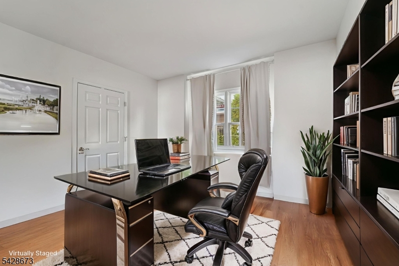 129 The Promenade Edgewater, NJ 07020 - Photo 7 of 17 a view of a workspace with furniture and a window