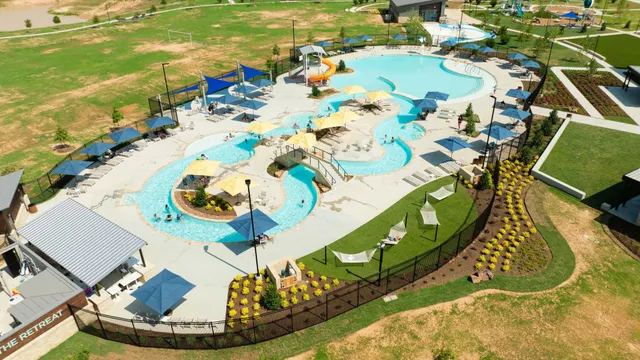 an aerial view of a house with a swimming pool