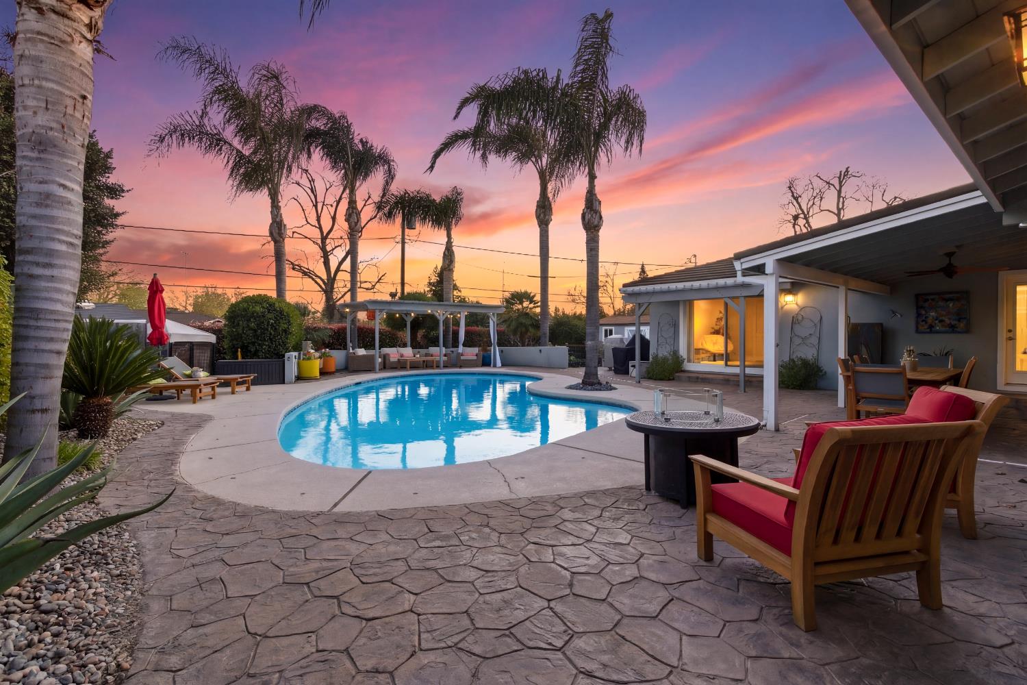a view of a swimming pool with a lounge chair