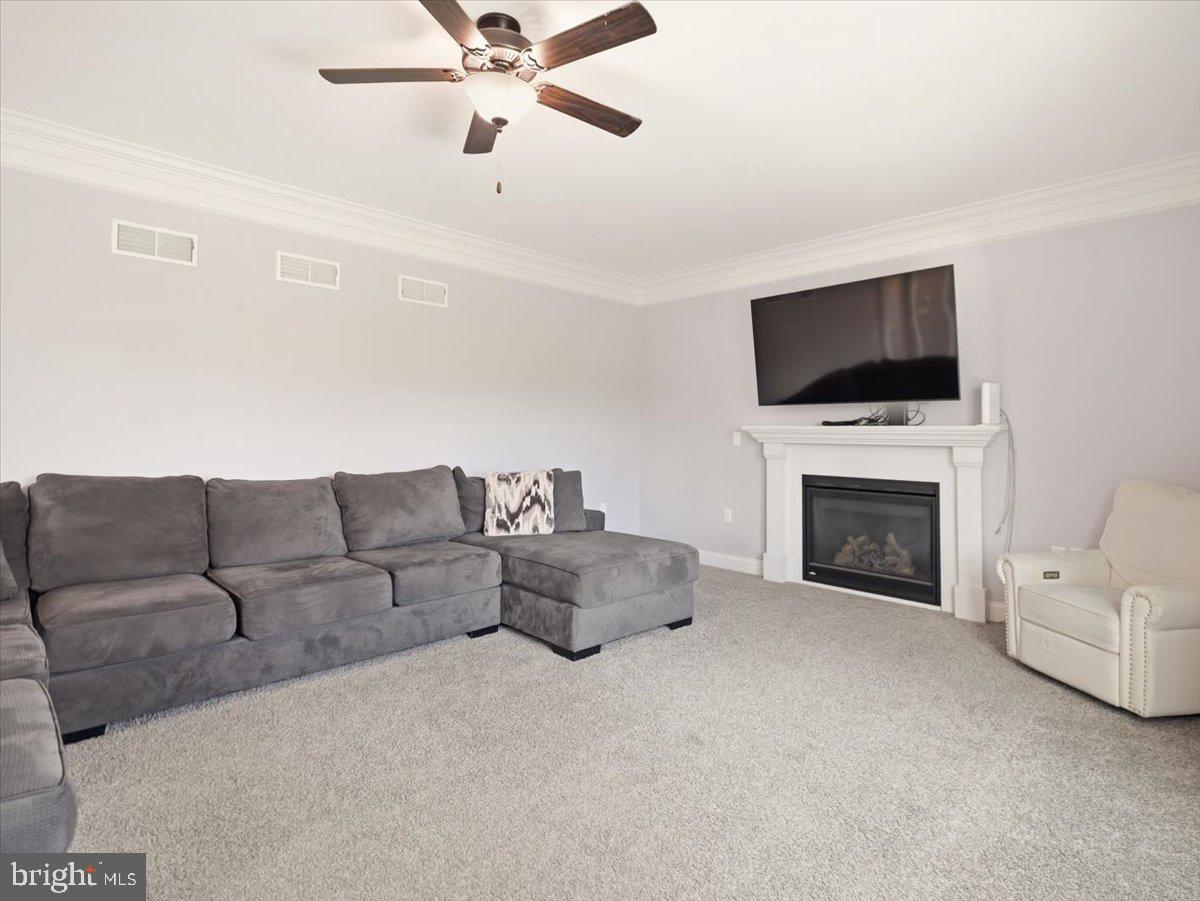 2006 Jelena Road Shippensburg, PA 17257 - Photo 17 of 47 a living room with furniture a fireplace and a flat screen tv