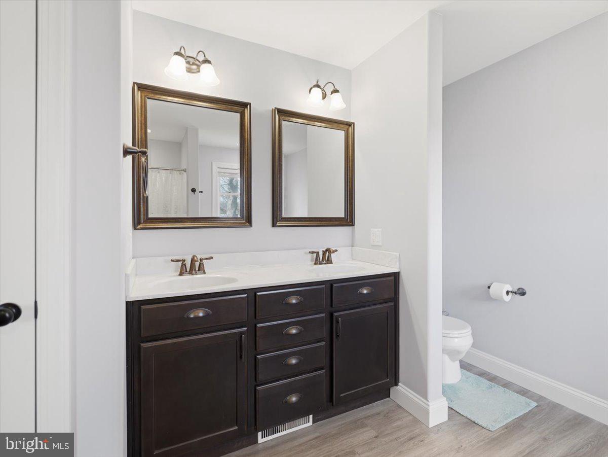 2006 Jelena Road Shippensburg, PA 17257 - Photo 25 of 47 a bathroom with a toilet sink and mirror