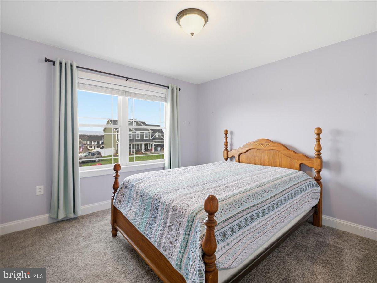 2006 Jelena Road Shippensburg, PA 17257 - Photo 29 of 47 a bed sitting in a bedroom next to a window