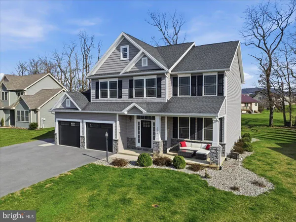 a front view of a house with yard