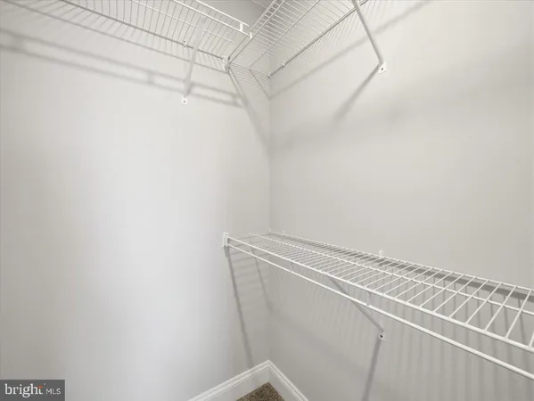 a view of a room with racks on the wall