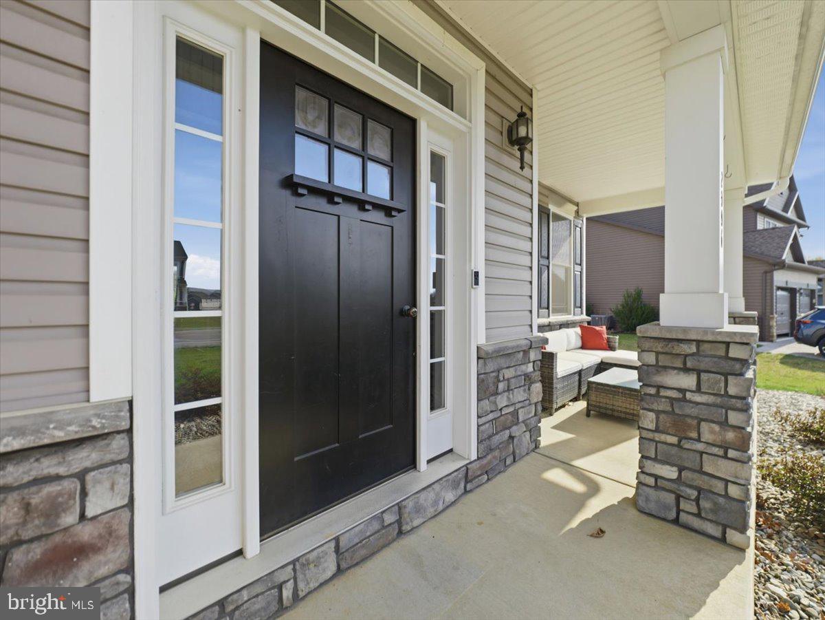 2006 Jelena Road Shippensburg, PA 17257 - Photo 44 of 47 a backyard of a house with barbeque oven table and chairs