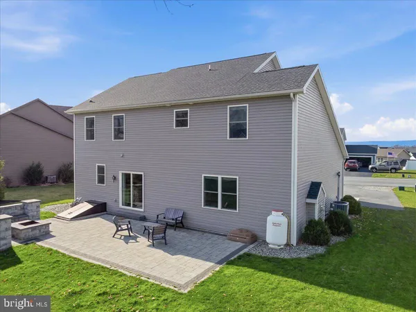 a front view of house with yard and outdoor seating
