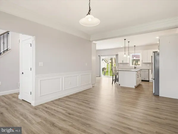 a view of a kitchen with wooden floor