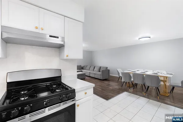 a kitchen with a stove and a cabinets