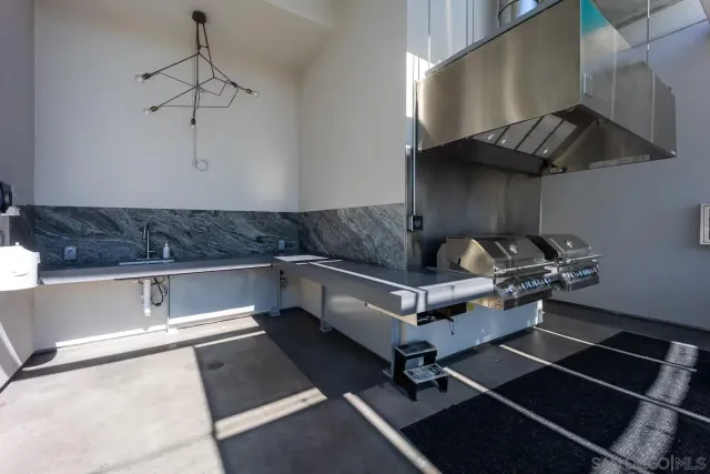 a kitchen with a stove cabinets and a counter top space