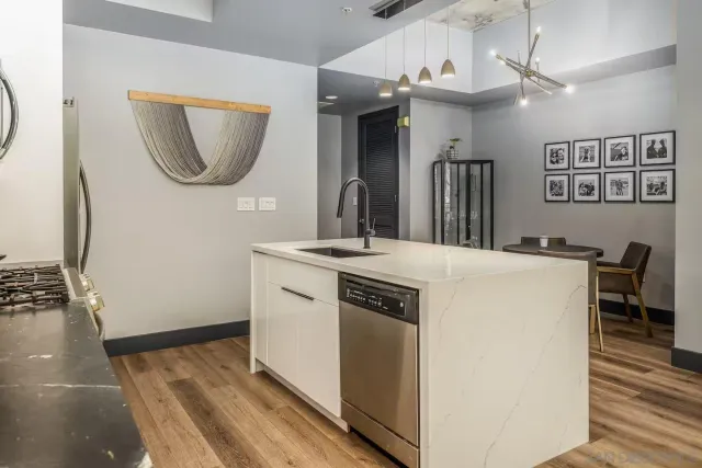 a view of kitchen with a sink and a mirror