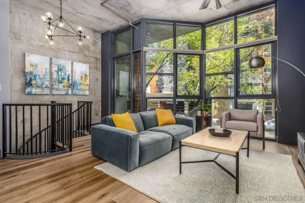 a living room with furniture and a large window