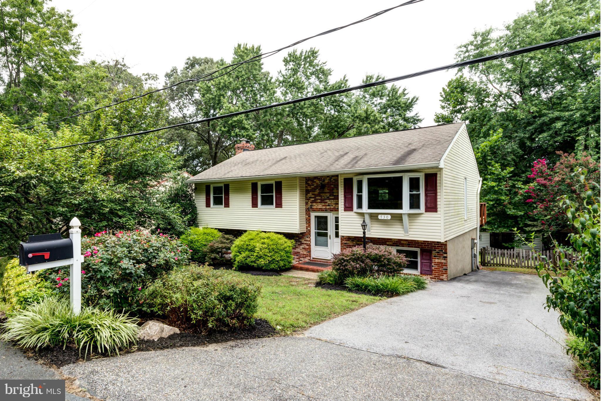 730 Rosewood Road Severn, MD 21144 - Photo 1 of 30 a view of house with a yard and potted plants