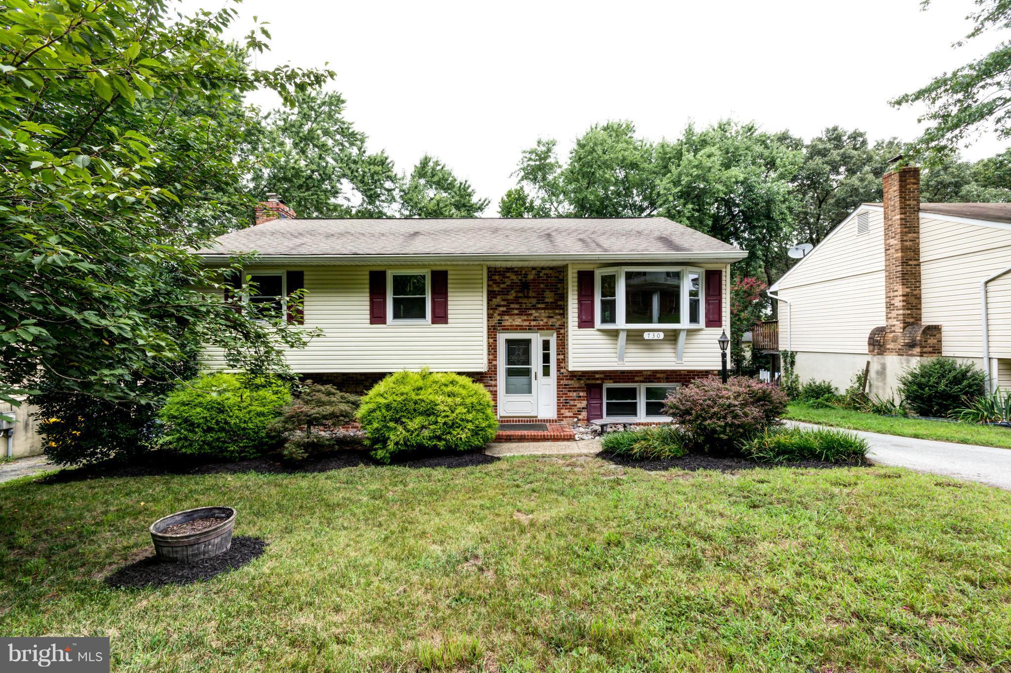 730 Rosewood Road Severn, MD 21144 - Photo 2 of 30 a view of a house with backyard and garden