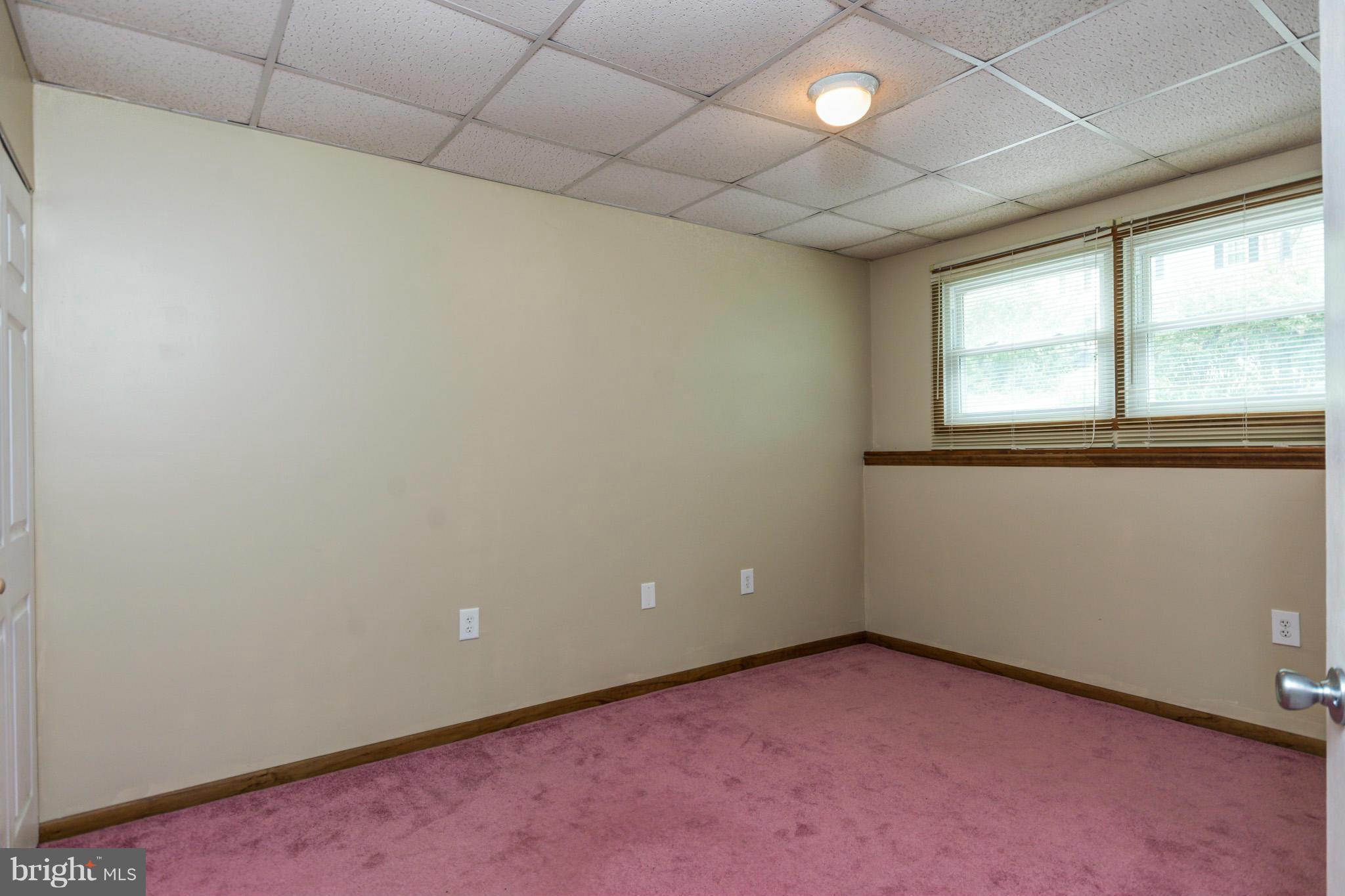 730 Rosewood Road Severn, MD 21144 - Photo 23 of 30 an empty room with a window