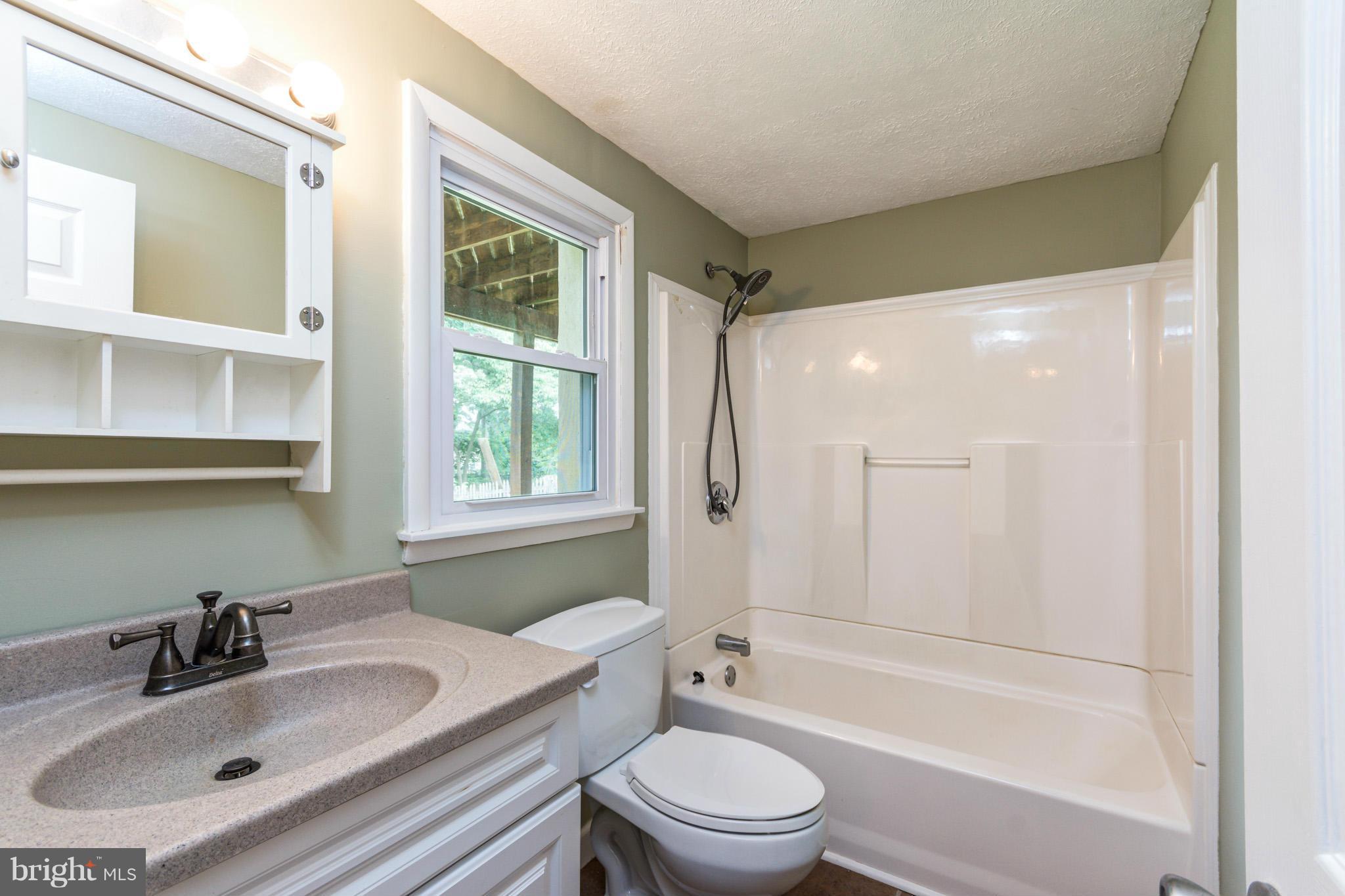 730 Rosewood Road Severn, MD 21144 - Photo 24 of 30 a bathroom with a sink toilet tub and shower