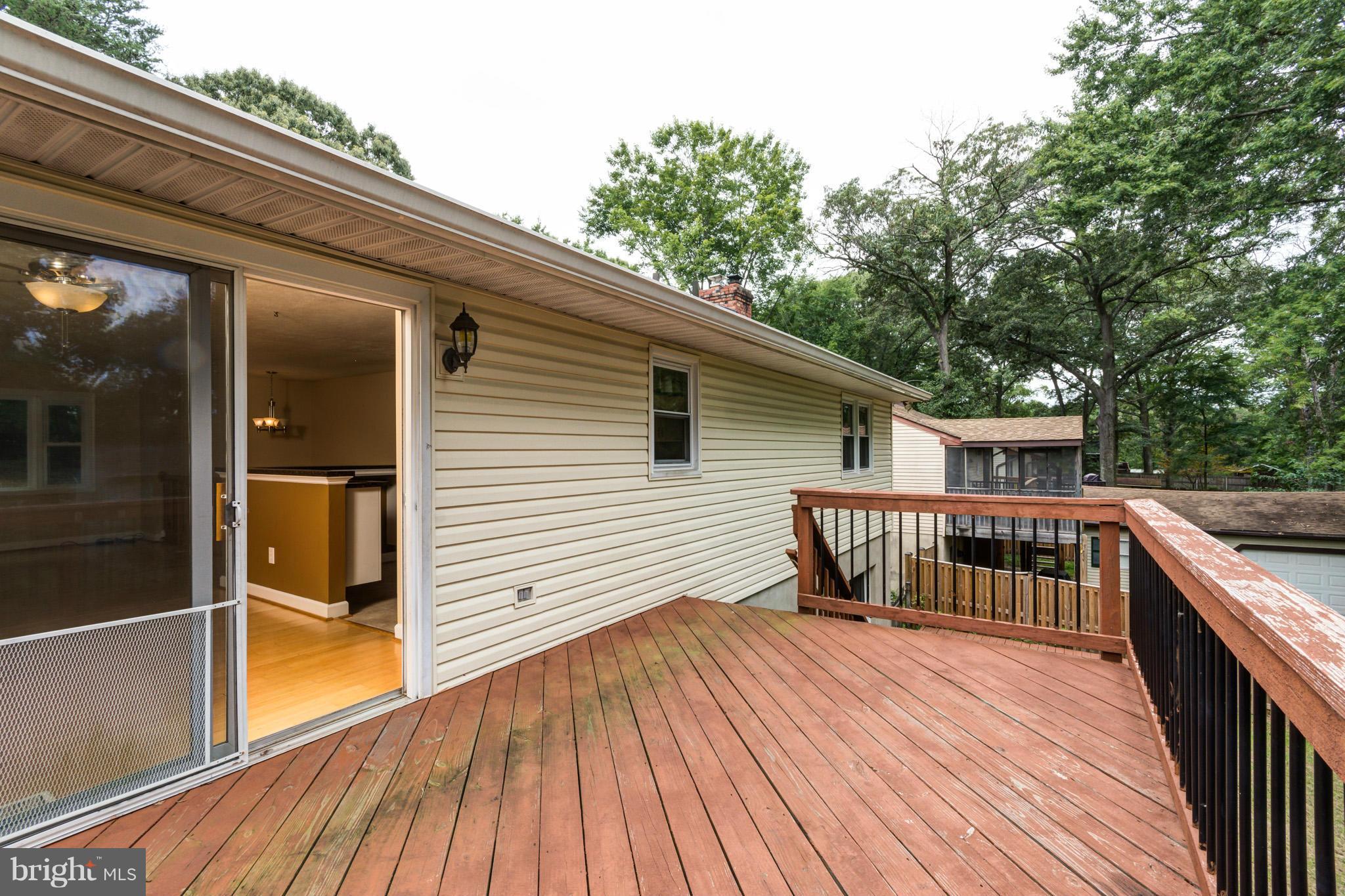 730 Rosewood Road Severn, MD 21144 - Photo 29 of 30 a view of backyard with deck and wooden floor