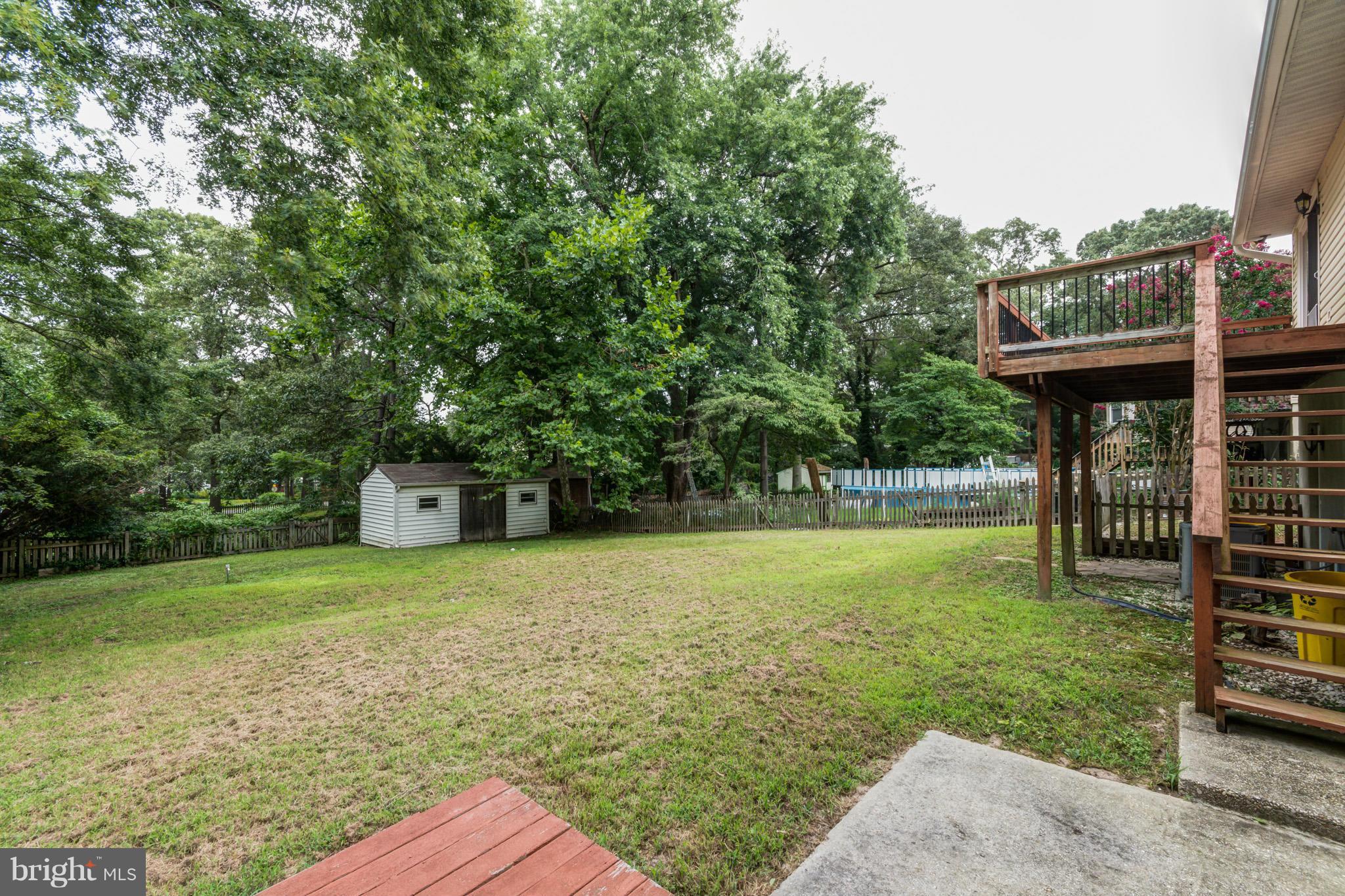 730 Rosewood Road Severn, MD 21144 - Photo 30 of 30 a view of a backyard with sitting area