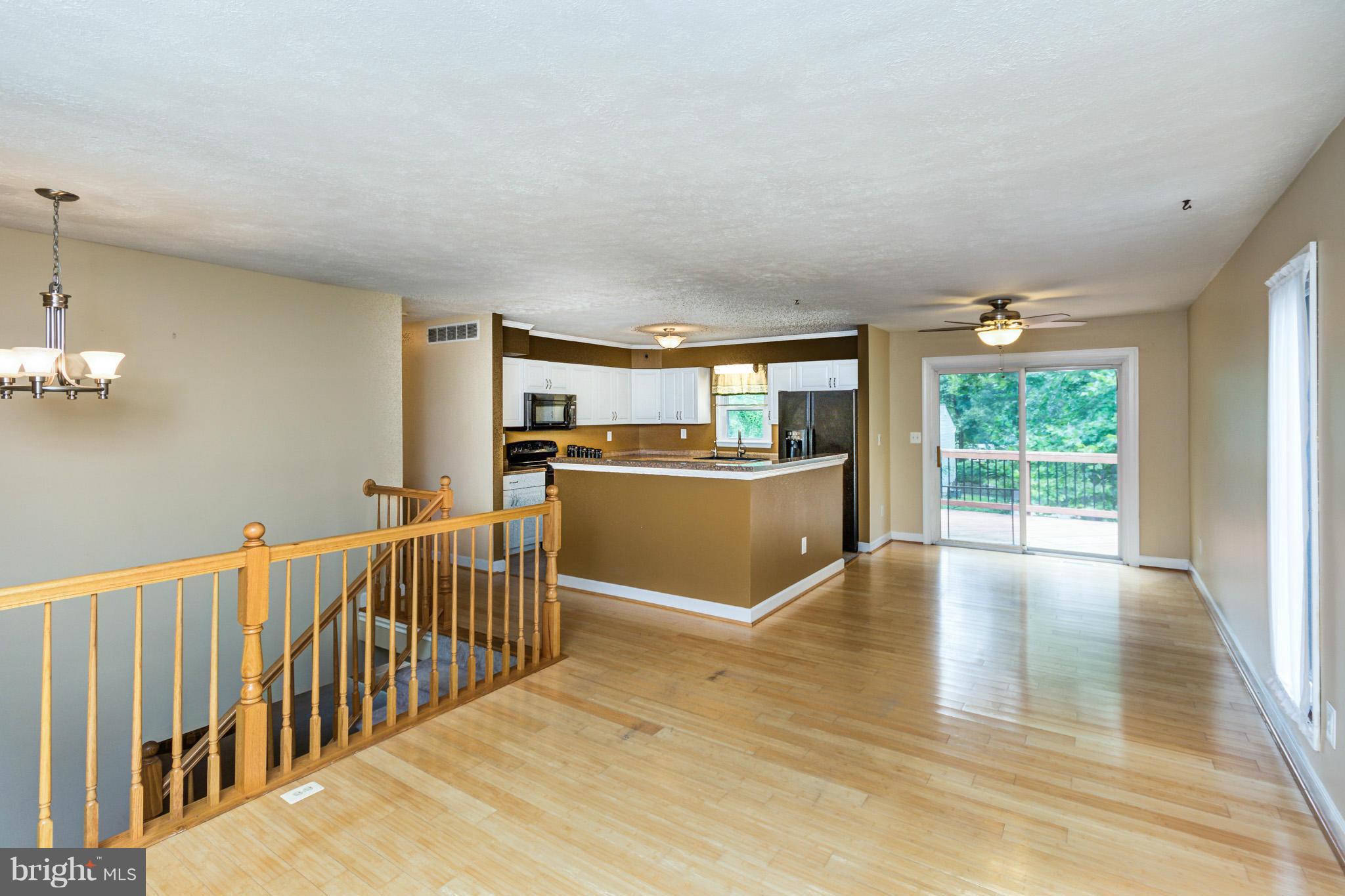 730 Rosewood Road Severn, MD 21144 - Photo 9 of 30 a view of a kitchen with furniture and wooden floor