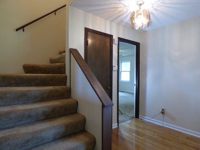 4628 Jones Road Macon, GA 31216 - Photo 16 of 25 a view of staircase with wooden floor and staircase