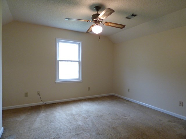 4628 Jones Road Macon, GA 31216 - Photo 17 of 25 an empty room with a window and a fan