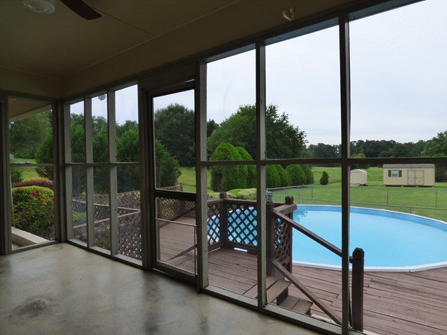 4628 Jones Road Macon, GA 31216 - Photo 20 of 25 a view of a balcony with floor to ceiling windows