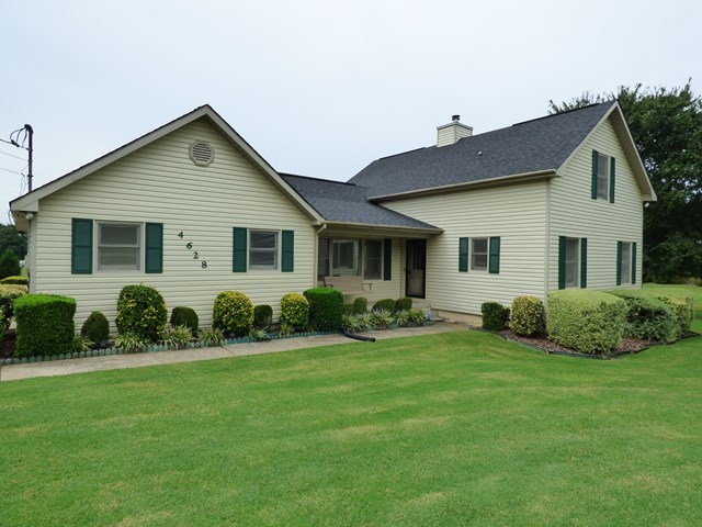 4628 Jones Road Macon, GA 31216 - Photo 3 of 25 a front view of a house with a garden