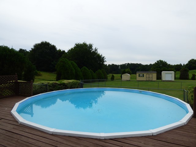 4628 Jones Road Macon, GA 31216 - Photo 22 of 25 a view of a swimming pool and a yard
