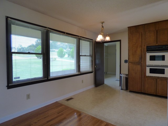 4628 Jones Road Macon, GA 31216 - Photo 7 of 25 a view of a kitchen with a dishwasher cabinets and a large window