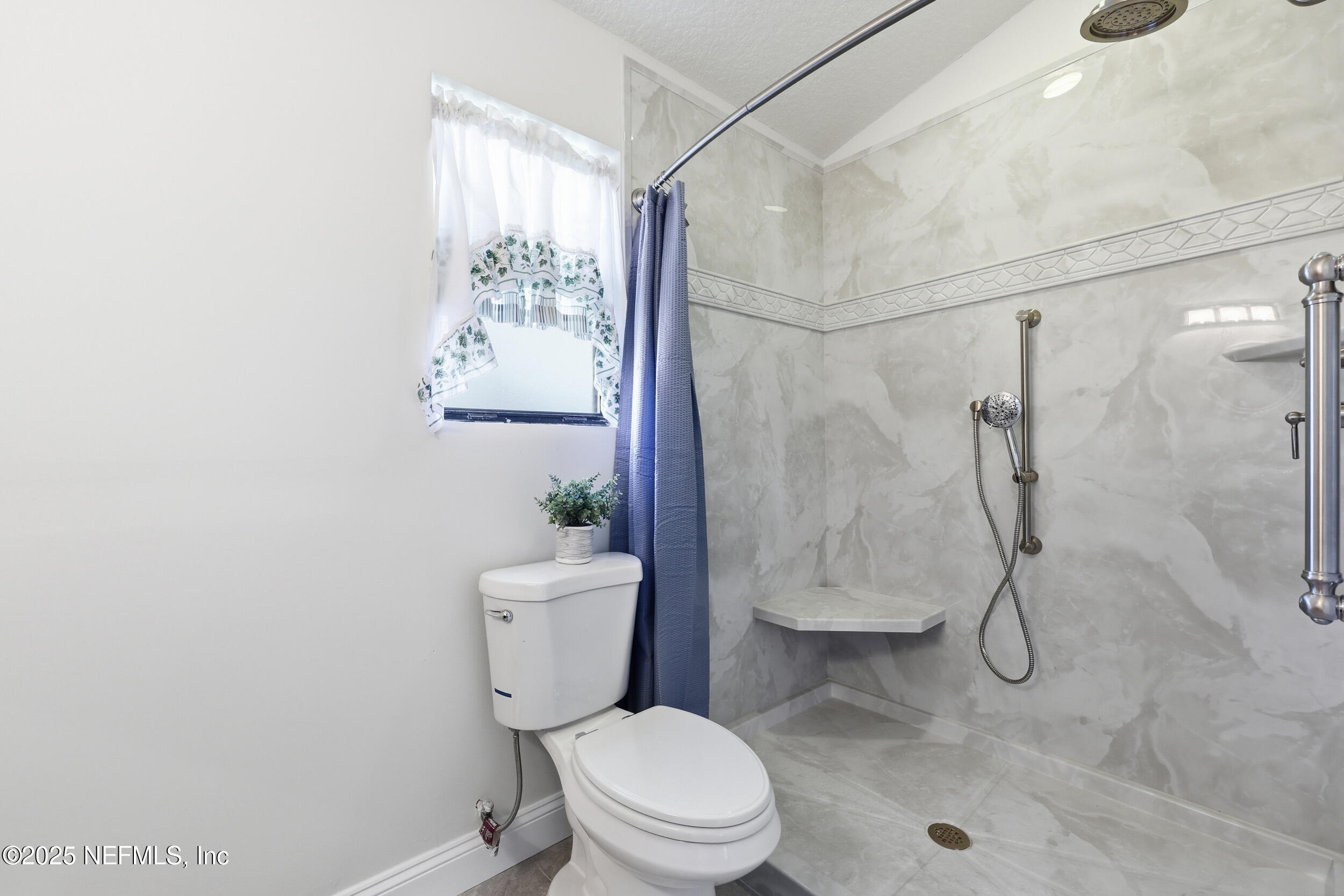 1626 Sandy Hollow Loop Middleburg, FL 32068 - Photo 16 of 40 a bathroom with a toilet sink and shower